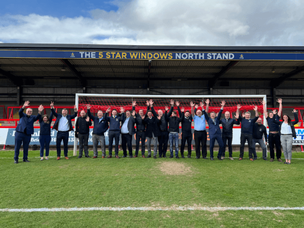 Some of the 5 Star Team in the goal mouth of the local Kidderminster Harriers football team.