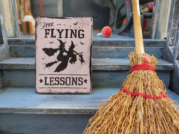 A sign and a broomstick