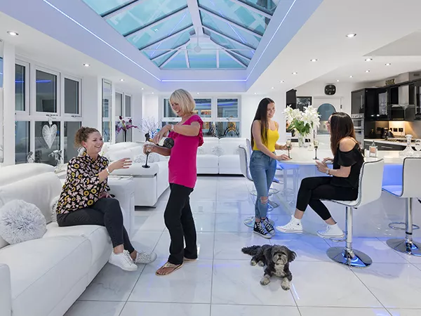 Four ladies inside a home extension