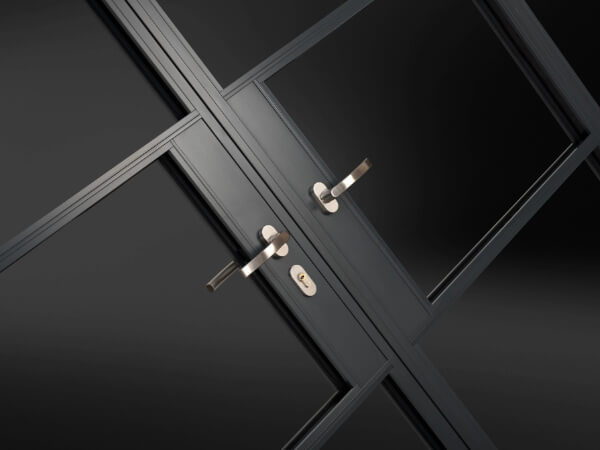 Crital Style french doors, zoomed in onto distinct Origin handles and key lock plate.