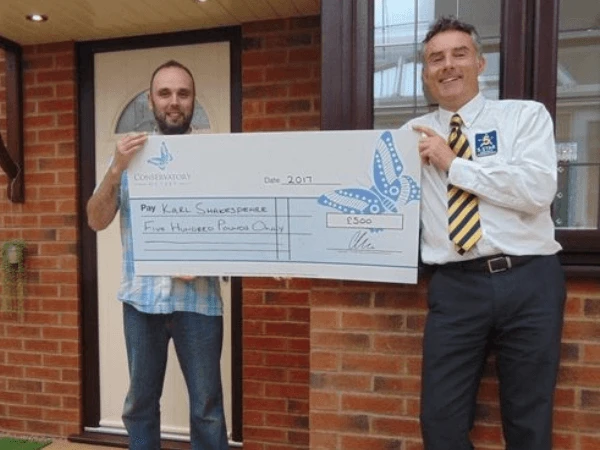 Karl Shakespear collects £500 cheque after completing a 5 Star review