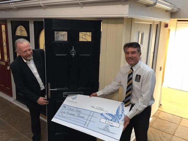 Mr Treby collects £500 cheque after completing a 5 Star review