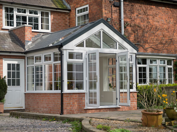 Conservatories With A Tiled And Glass Roof Plus Georgian Bars.