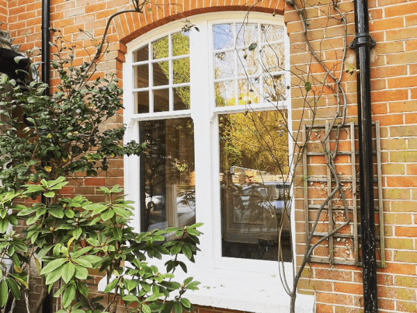 White Ultimate rose arched window with high sliding sash