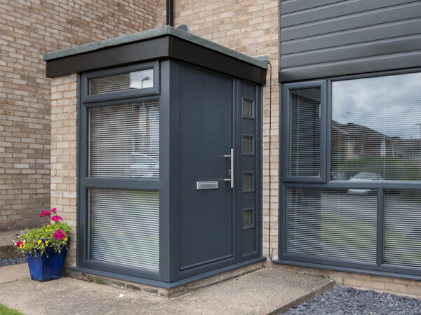 porches come in many colours this grey example has a side door entrance and flat roof.