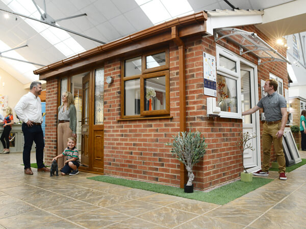 Kidderminster Showroom. The Central Tiled Roof Brick Extension Display, With Oak Windows And Front Composite Door. To The Left A White Back Door And Adjoining Window.