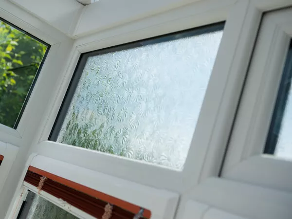 Privacy Glazing in white window with daisy pattern looking out