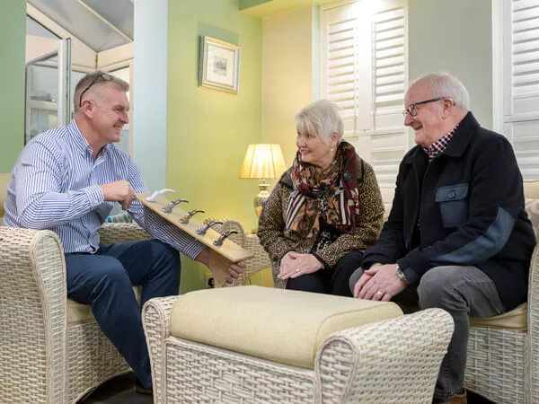 5 Star designer with 2 customers sitting in 5 Star Kidderminster showroom