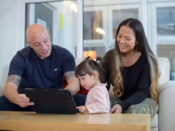 Two adults show a child our online introduce a 5 Star friend form