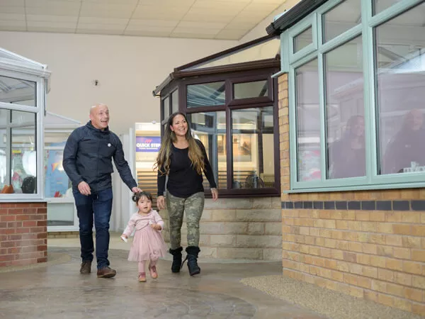 A couple with young child visiting 5 Star's Worcester Showroom